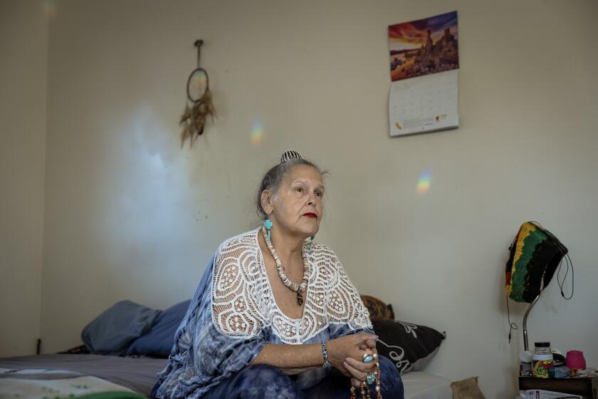 Bonnie Metcalf meditates at her Sacramento home on July 20, 2023. Metcalf suffers from sarcoidosis, an inflammatory disease, and takes cannabis products to ease the pain. Photo by Rahul Lal for CalMatters