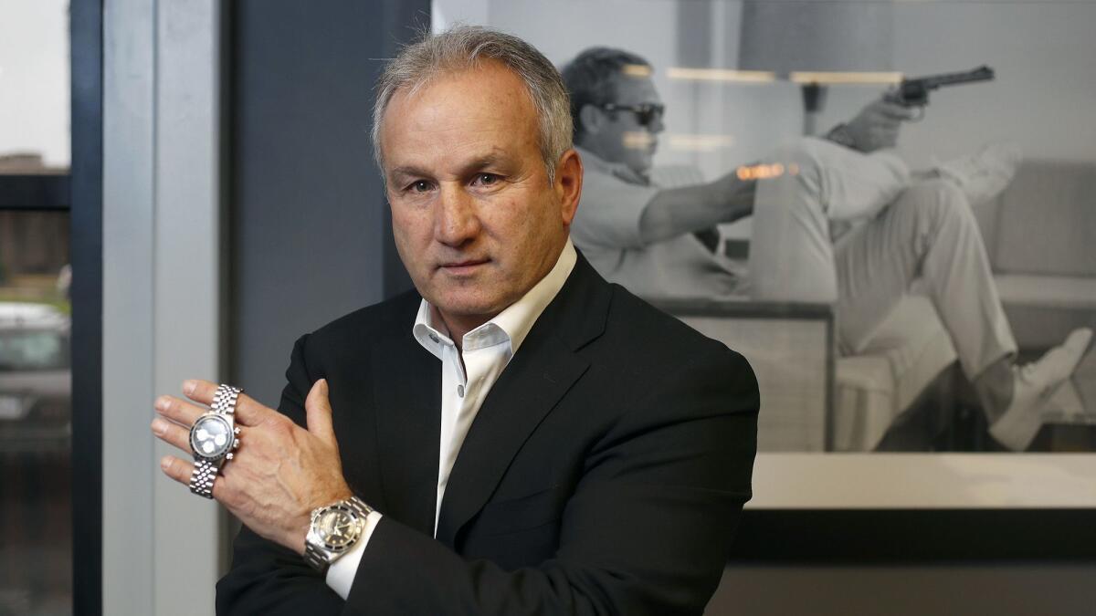Paul Altieri, chief executive of Bob's Watches, recently moved the company's headquarters to Newport Beach. Bob's Watches is the world's largest online exchange for preowned Rolexes. Late film icon Steve McQueen is on the poster behind Altieri, wearing a Rolex.
