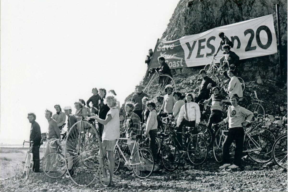 A group of bicyclists rally around a Yes on Prop 20 sign in 1972