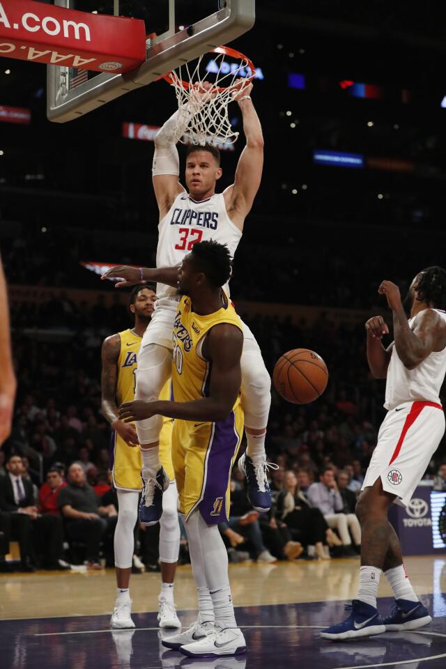 Clippers forward Blake Griffin dunks with authority over Lakers forward Julius Randle during the second half.
