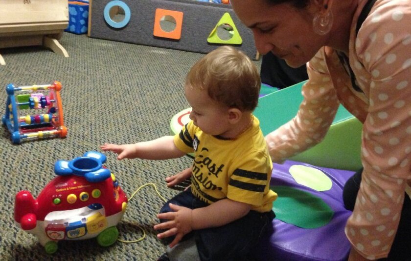 San Diego Assemblywoman Lorena Gonzalez has proposed a bill that would give families on public assistance $80 a month for diapers. Above, Beth Capper plays with her son Ezekiel Goss at the Children's Institute's Mid-Wilshire campus, where she received diapers she otherwise could not afford.