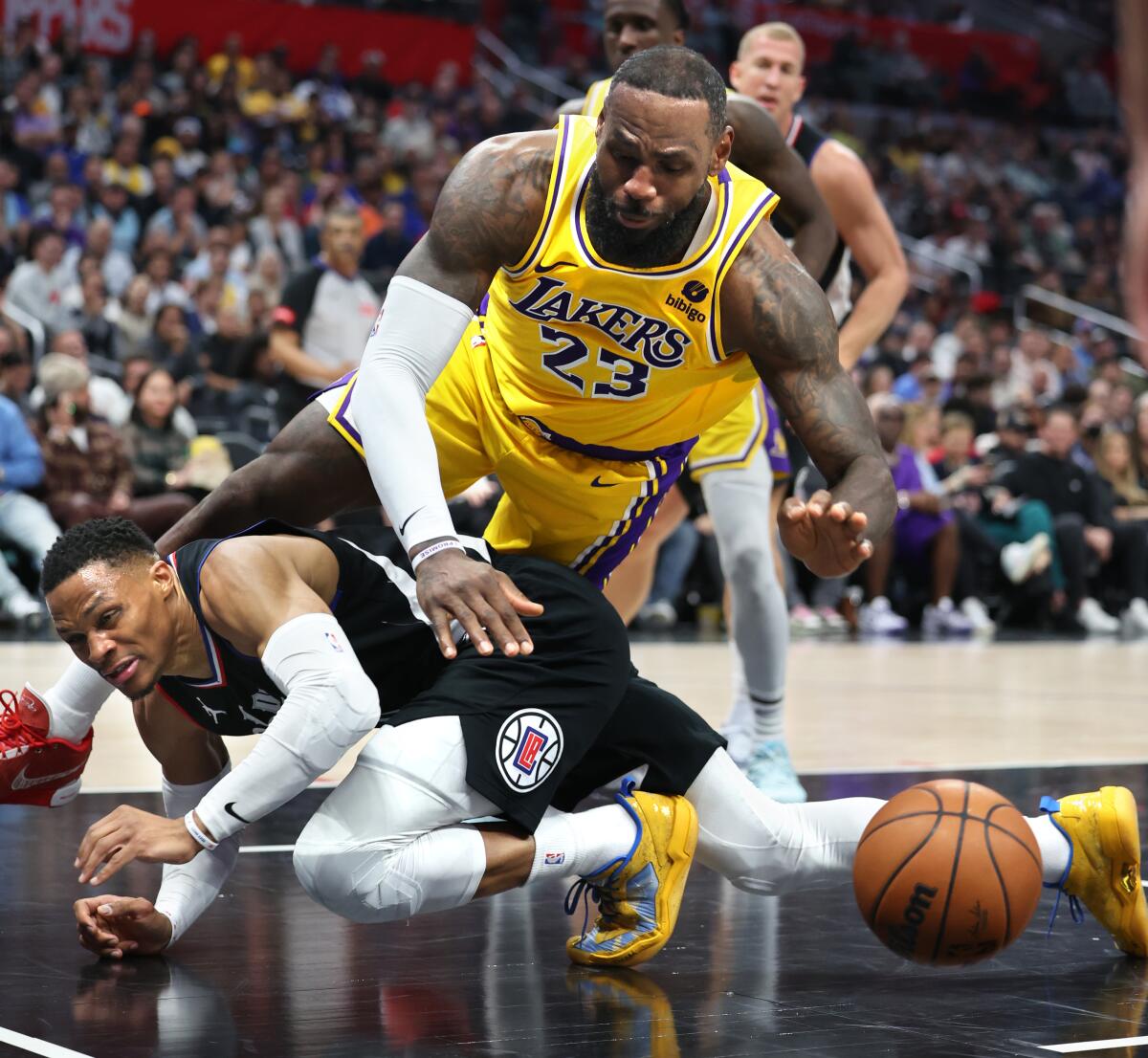 LeBron James and Russell Westbrook go for a loose ball in the fourth quarter.