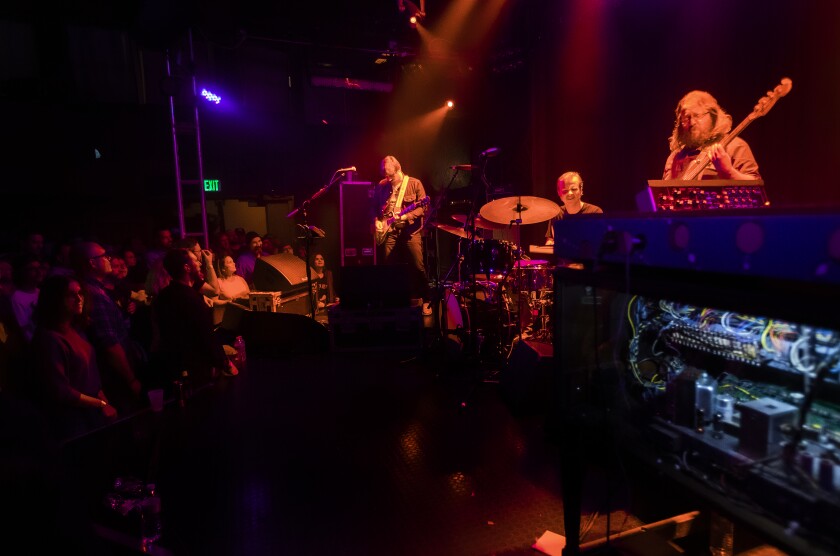 Sturgill Simpson, from left, performs at the Troubadour with drummer Miles Miller and bassist Chuck Bartels.