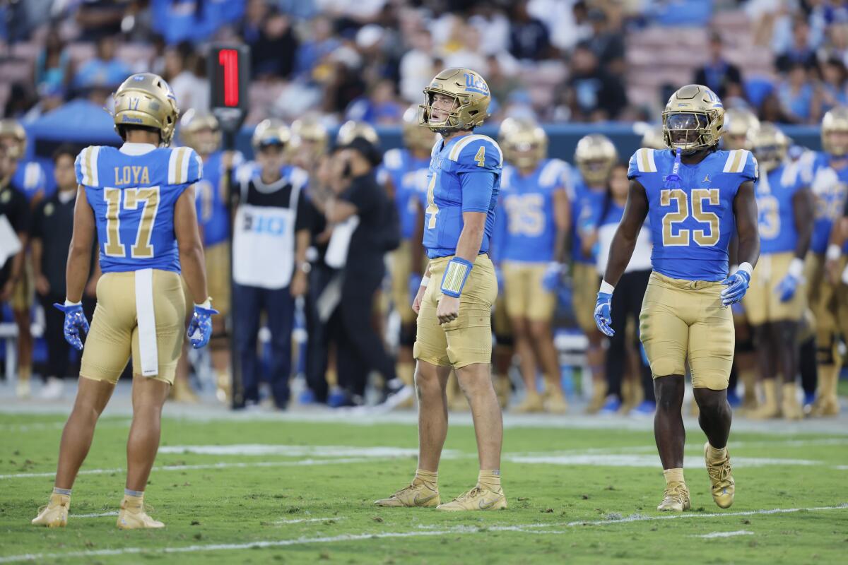 UCLA quarterback Ethan Garbers catches his breath after being sacked against Indiana