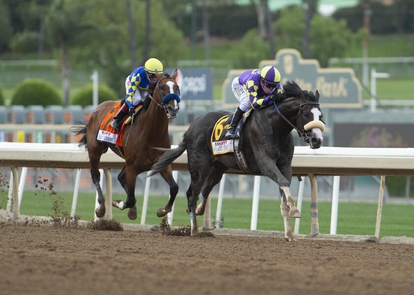 Honor A.P., with jockey Mike Smith aboard, glides past Authentic en route to winning the Santa Anita Derby by 2¾ lengths.