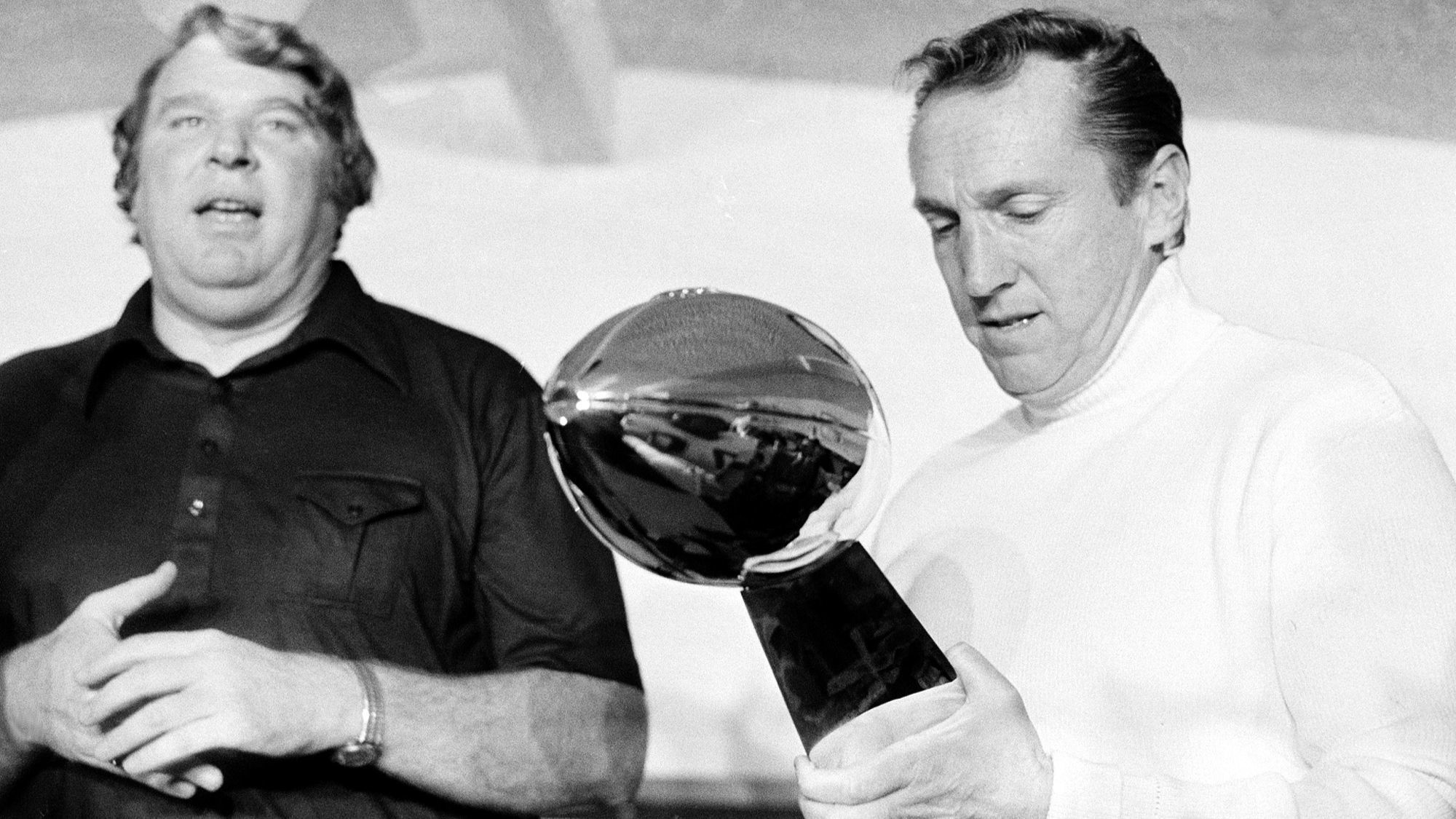 John Madden, left, and Oakland Raiders owner Al Davis talk with the media after winning the Super Bowl in 1977.