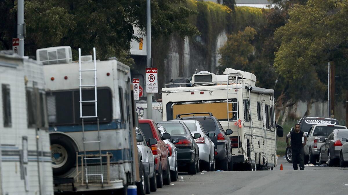 Motorhomes sit along Grand Avenue in South Los Angeles.