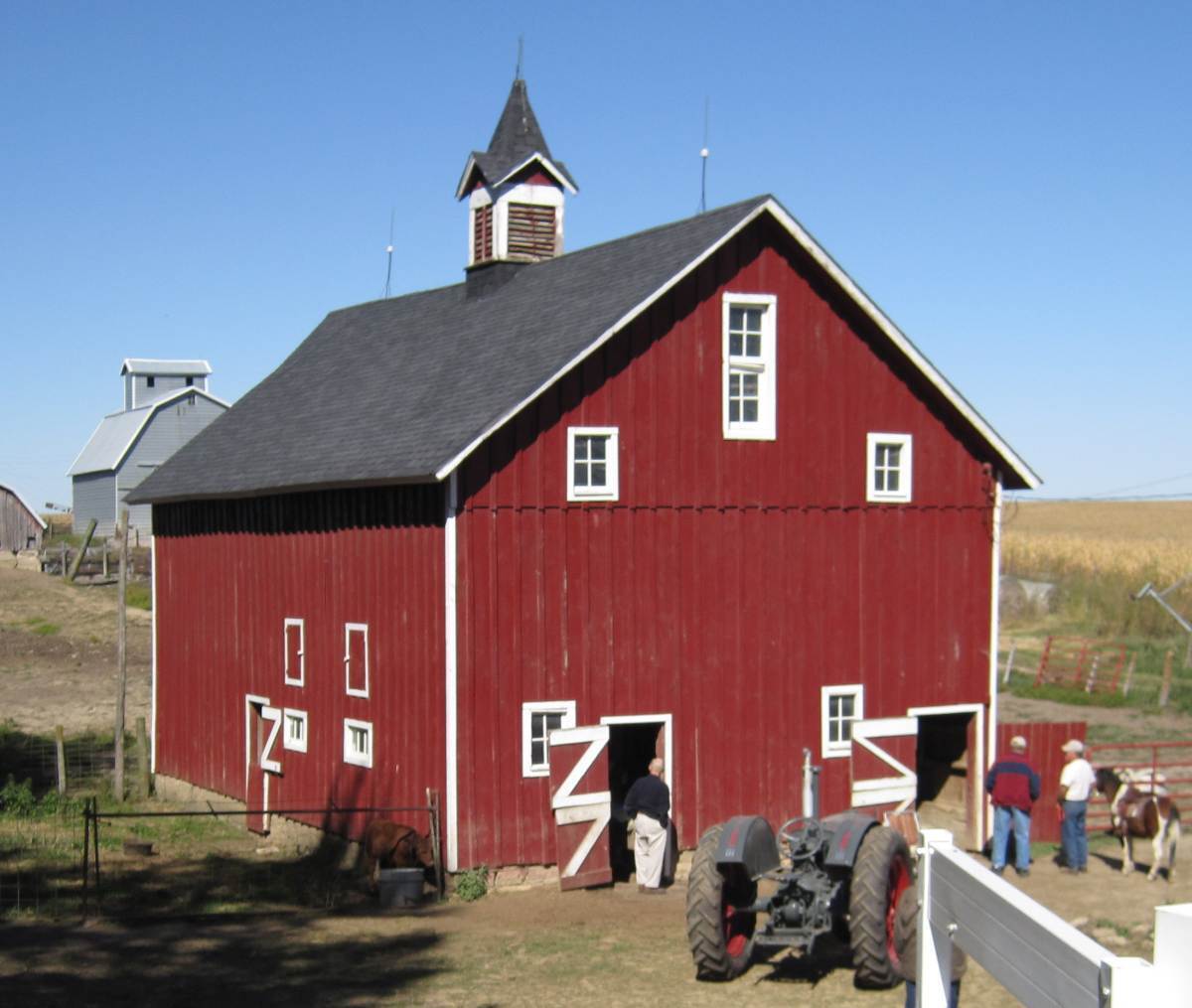 Buck Barn, State Center, Iowa. Lovely turn-of-the-century barn has wooden track in the haymow. Cupola has the original bell. Barn has been in the family for four generations. Photo by Jeffrey Fitz-Randolph.