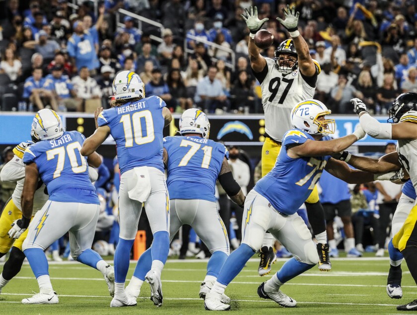 Steelers defensive end Cameron Heyward (97) blocks a pass thrown by Chargers quarterback Justin Herbert.