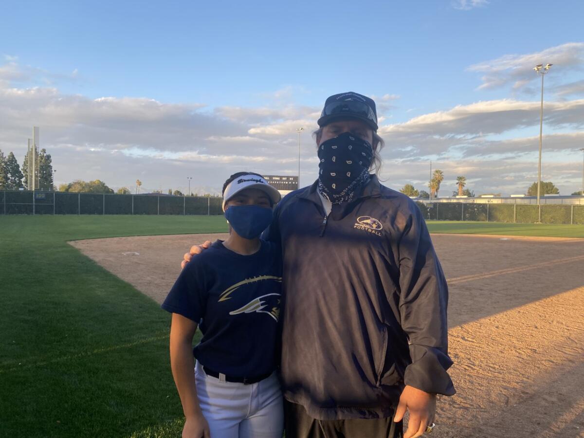 Birmingham's Jim Rose is coaching his daughter, Jessica, on the softball team.