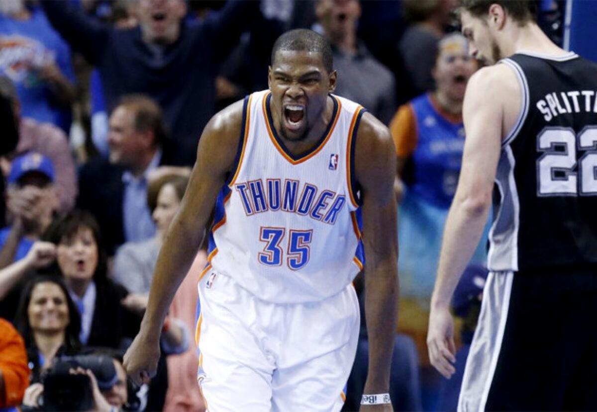 Oklahoma City Thunder forward Kevin Durant (35) celebrates after a dunk against the San Antonio Spurs.