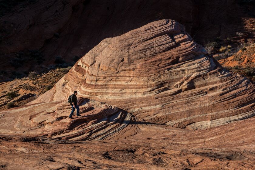 LAS VEGAS, NV - FEBRUARY 28: Arch rock formations at the Valley of Fire, Nevada's first and oldest State Park, are viewed on February 28, 2018 near Las Vegas, Nevada. The Valley of Fire, located one hour north of Las Vegas, derives its name from red sandstone formations, formed from great shifting sand dunes during the age of dinosaurs, more than 150 million years ago. Complex uplifting and faulting of the region, followed by extensive erosion, have created the present landscape. (Photo by George Rose/Getty Images)