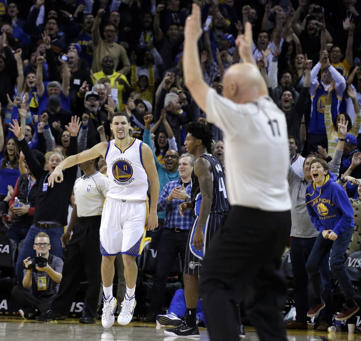 Golden State's Klay Thompson celebrates a score against Orlando on Dec. 2, 2014, in Oakland.