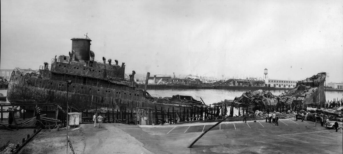 June 23, 1947: The remains of the tanker Markay rest in Los Angeles Harbor the day after explosion rocked the vessel.