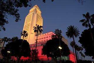 Los Angeles, California April 20, 2023-Los Angeles City Hall is lit up in honor of the passing of former mayor Richard Riordan Thursday night. (Wally Skalij/Los Angeles Times)