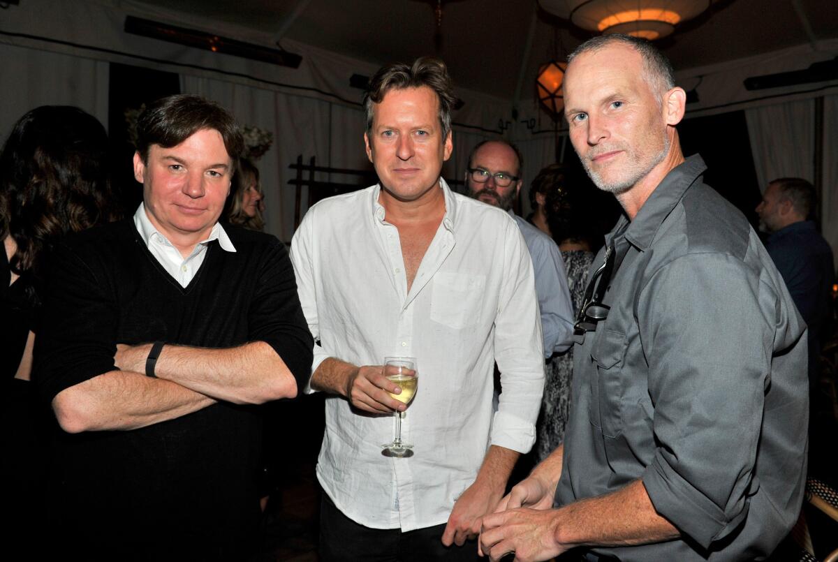 Mike Myers, left, Doug Aitken, center, and Matthew Barney attend the dinner for Aitken's exhibition "Still Life." on Sept. 6