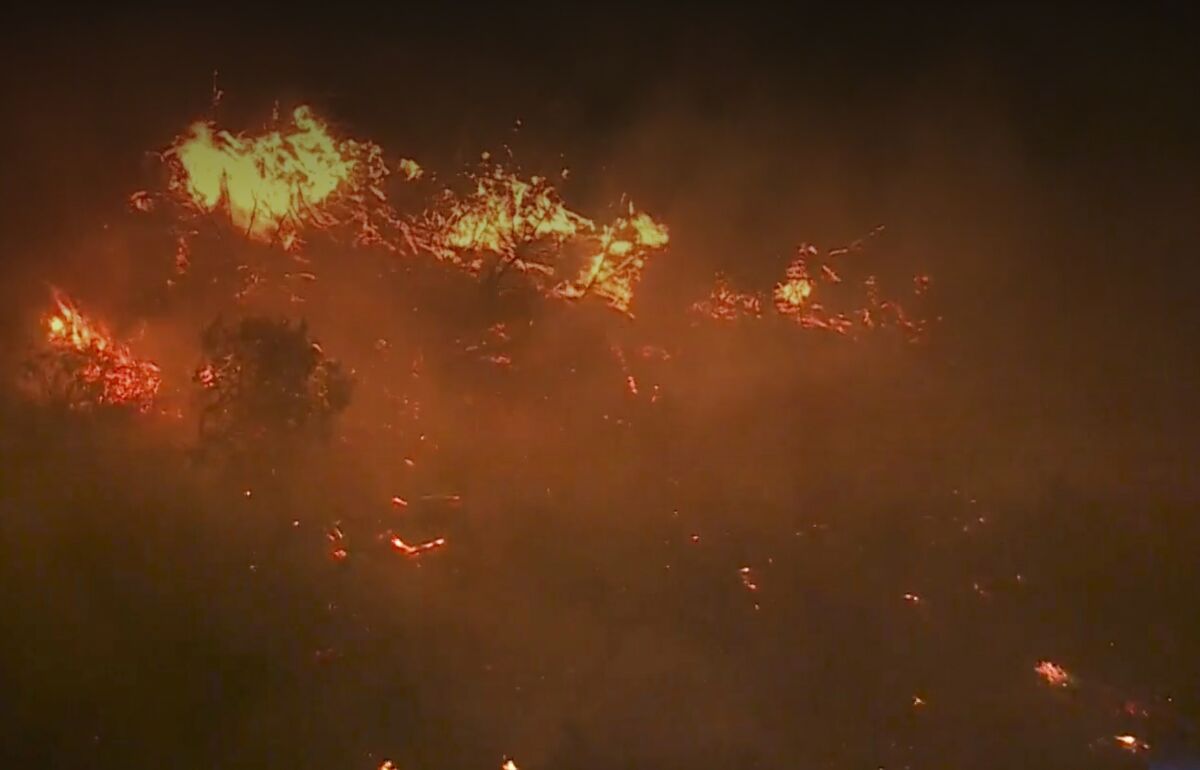 Flames and smoke from a brush fire