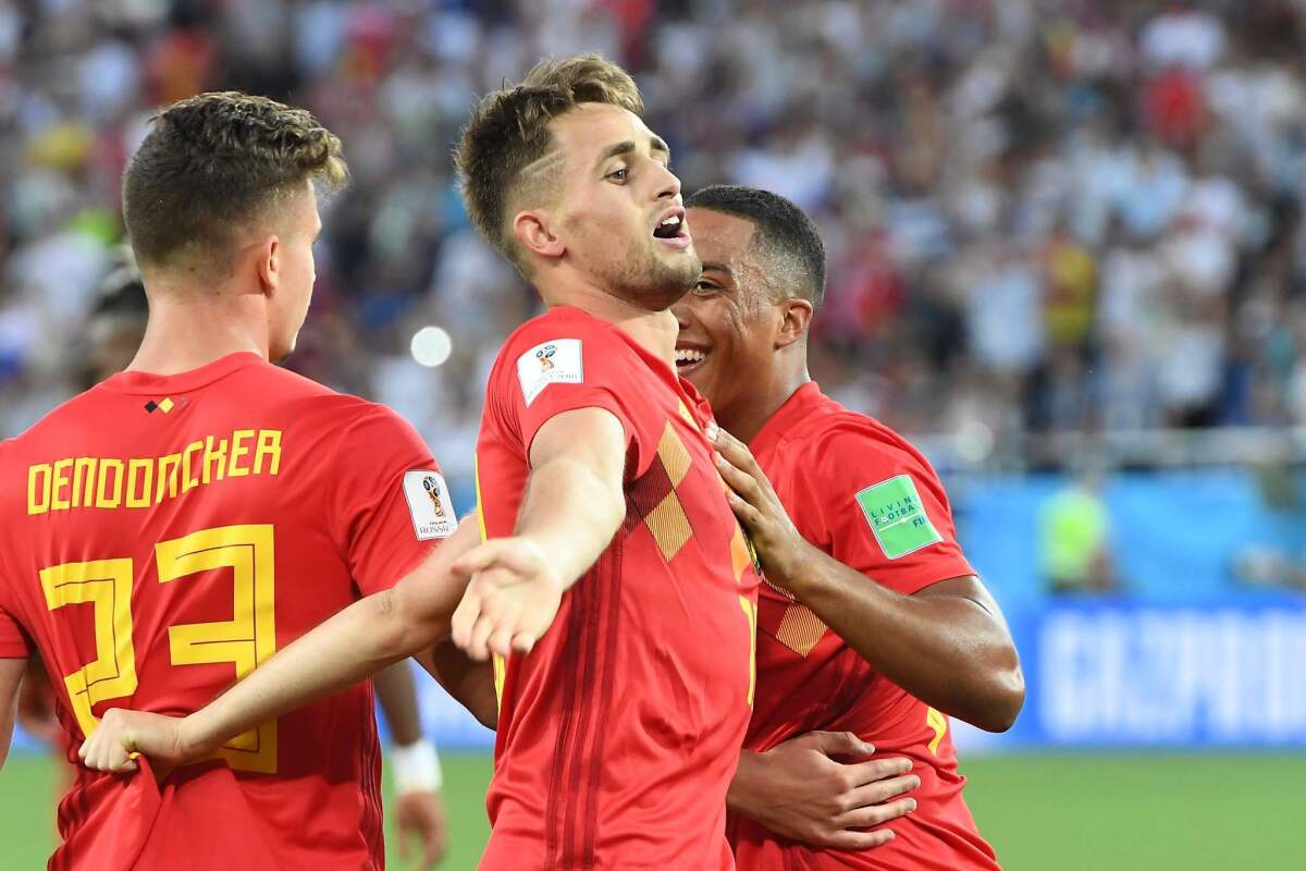 Belgium forward Adnan Januzaj, center, celebrates his goal against England with teammates on Thursday.