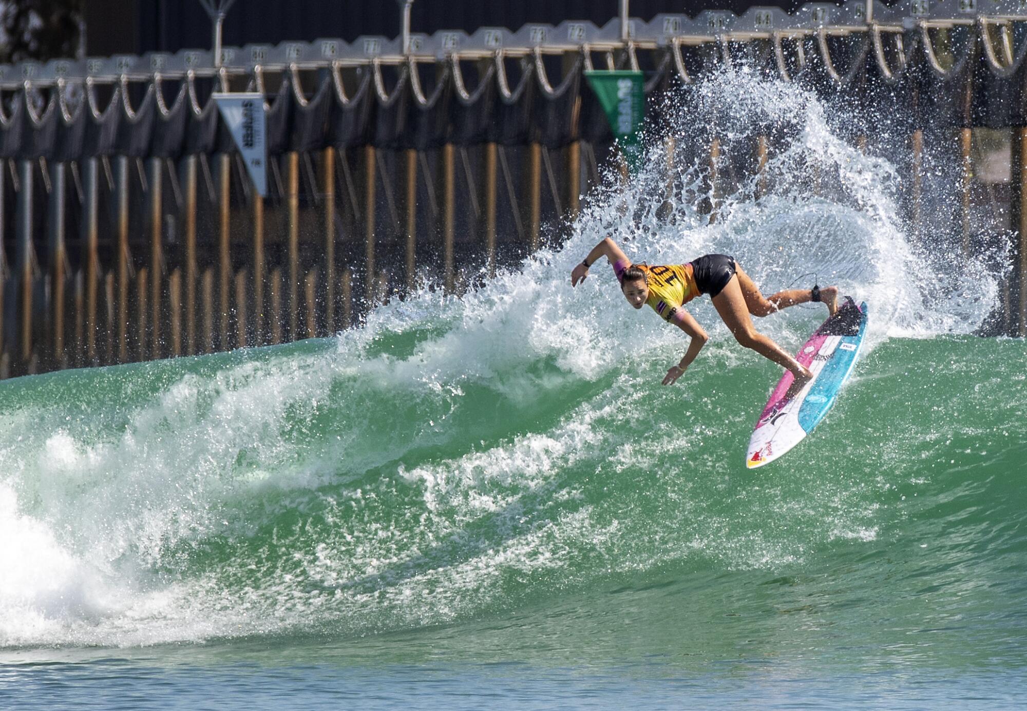 Four-time world champion Carissa Moore does a slashing turn.