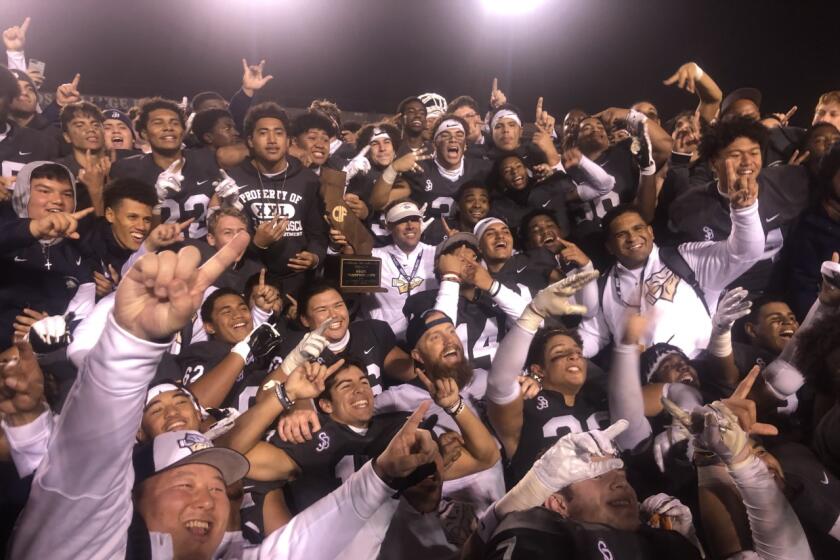 St. John Bosco players and coaches celebrating bowl victory in 2019.