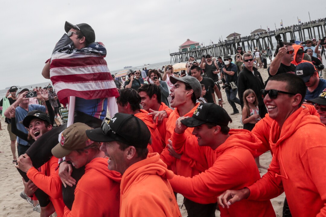 Griffin Colapinto is carried by the surf after winning the final