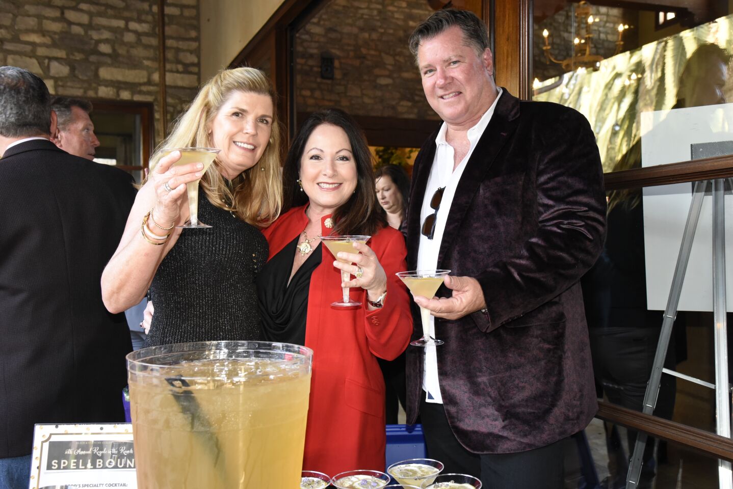 BCG President Cathy Miller, Gala co-chair Maria Parnell and Todd Parnell, enjoying lavender martinis