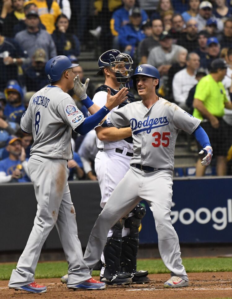 Dodgers Cody Bellinger celebrates with Manny Machado after hitting a two run homerun the second inning.
