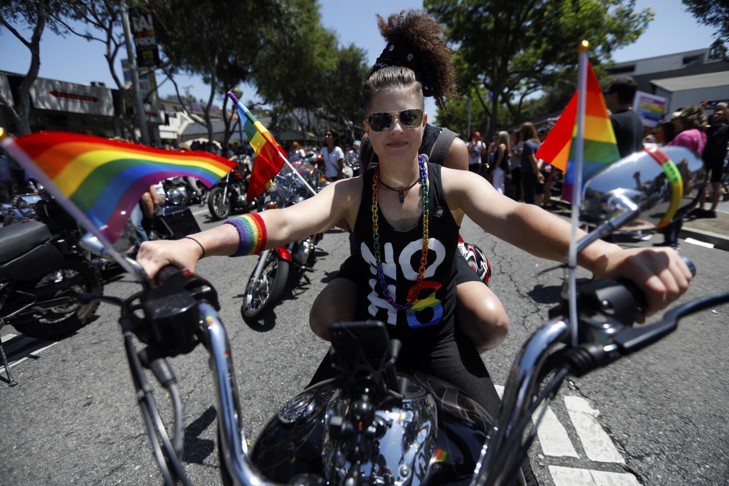 Katrina Vinson rides a motorcycle through West Hollywood in the annual LA Pride Parade on Sunday.