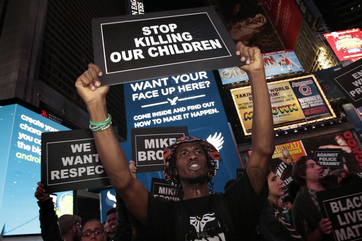Keeshan Harley, 20, and others march from Union Square to Times Square after learning that a grand jury in Missouri did not indict police Officer Darren Wilson in the Michael Brown shooting.
