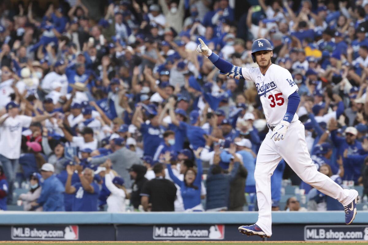 Cody Bellinger celebrates after hitting a game-tying, three-run home run in the eighth inning of a 6-5 win.