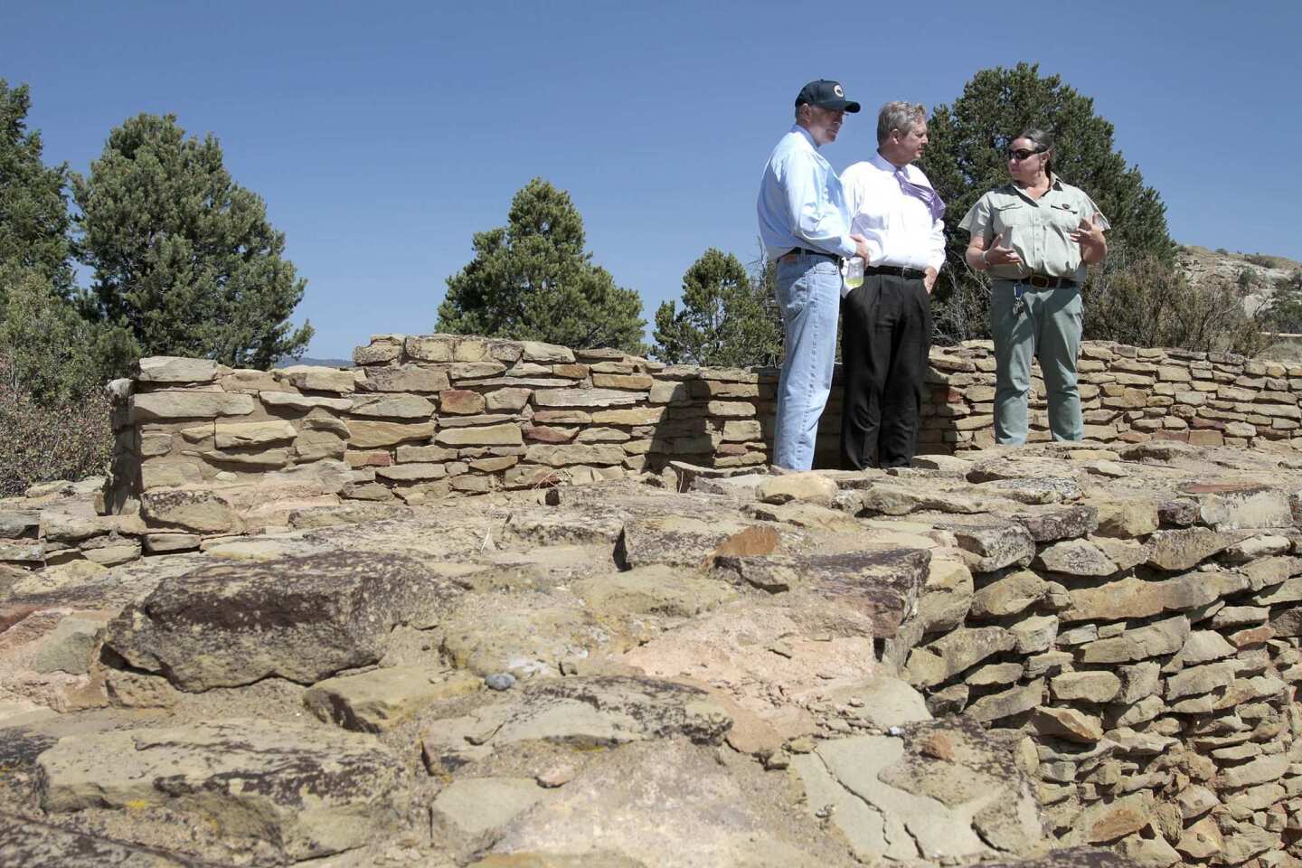 San Juan National Forest archaeologist Wendy Sutton explains features of Chimney Rock's Ridge House ruin to U.S. Interior Secretary Ken Salazar and U.S. Agriculture Secretary Tom Vilsack on the day of the monument's declaration.