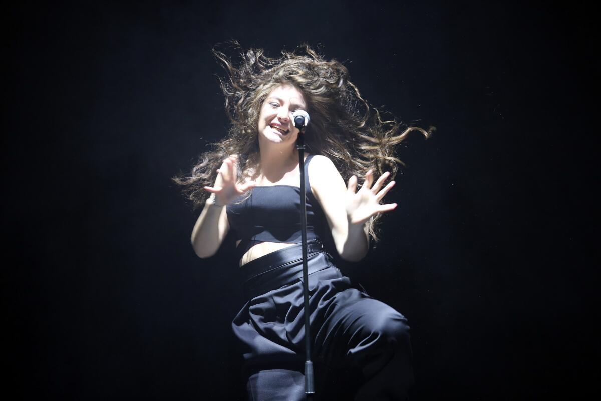Lorde performs live at Dunedin Town Hall on Oct. 29, 2014, in Dunedin, New Zealand. She's one of the acts set for the 2014 American Music Awards.