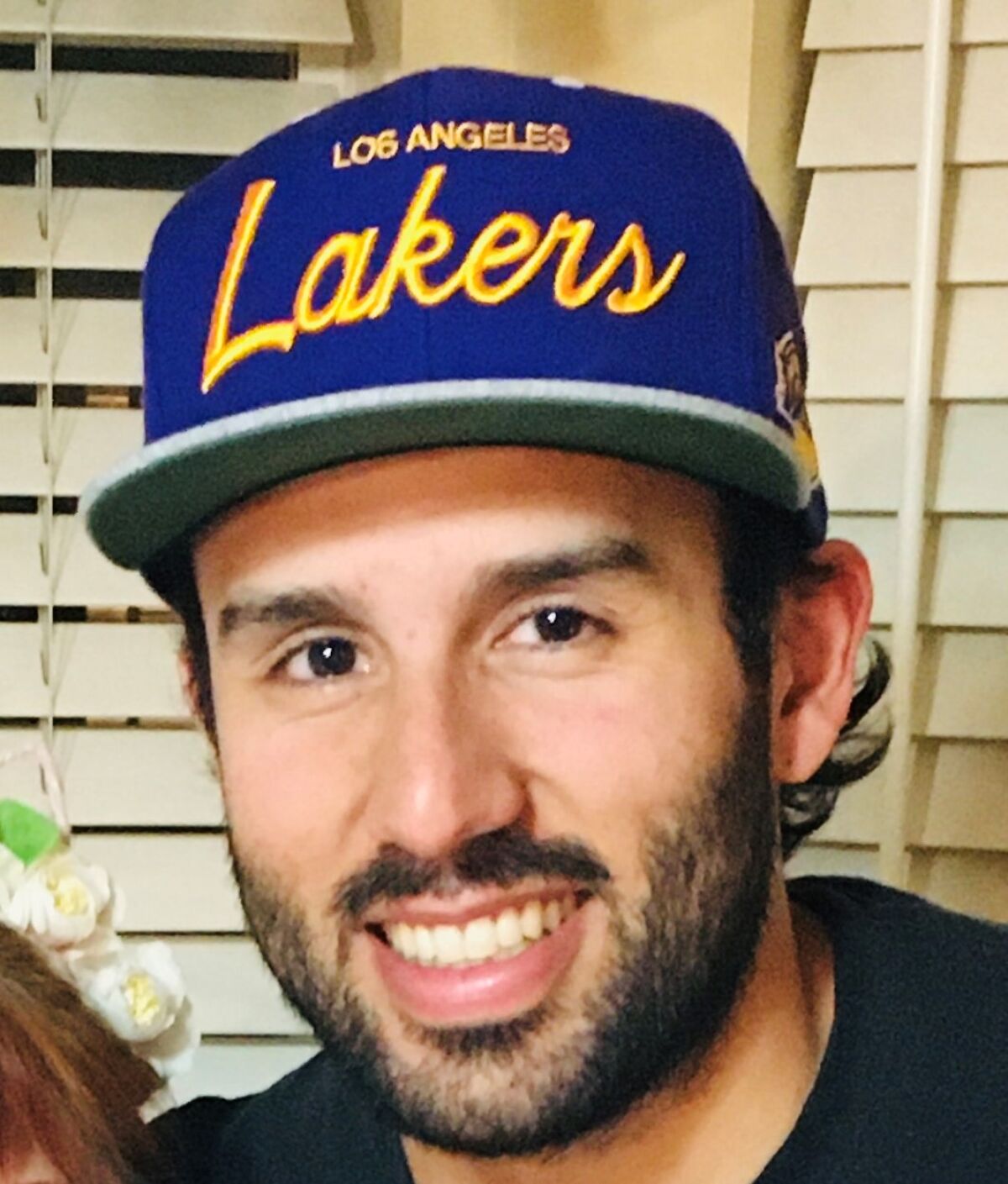 Latinx Files reader Walter Franco poses for the camera while wearing a Los Angeles Lakers snapback. 
