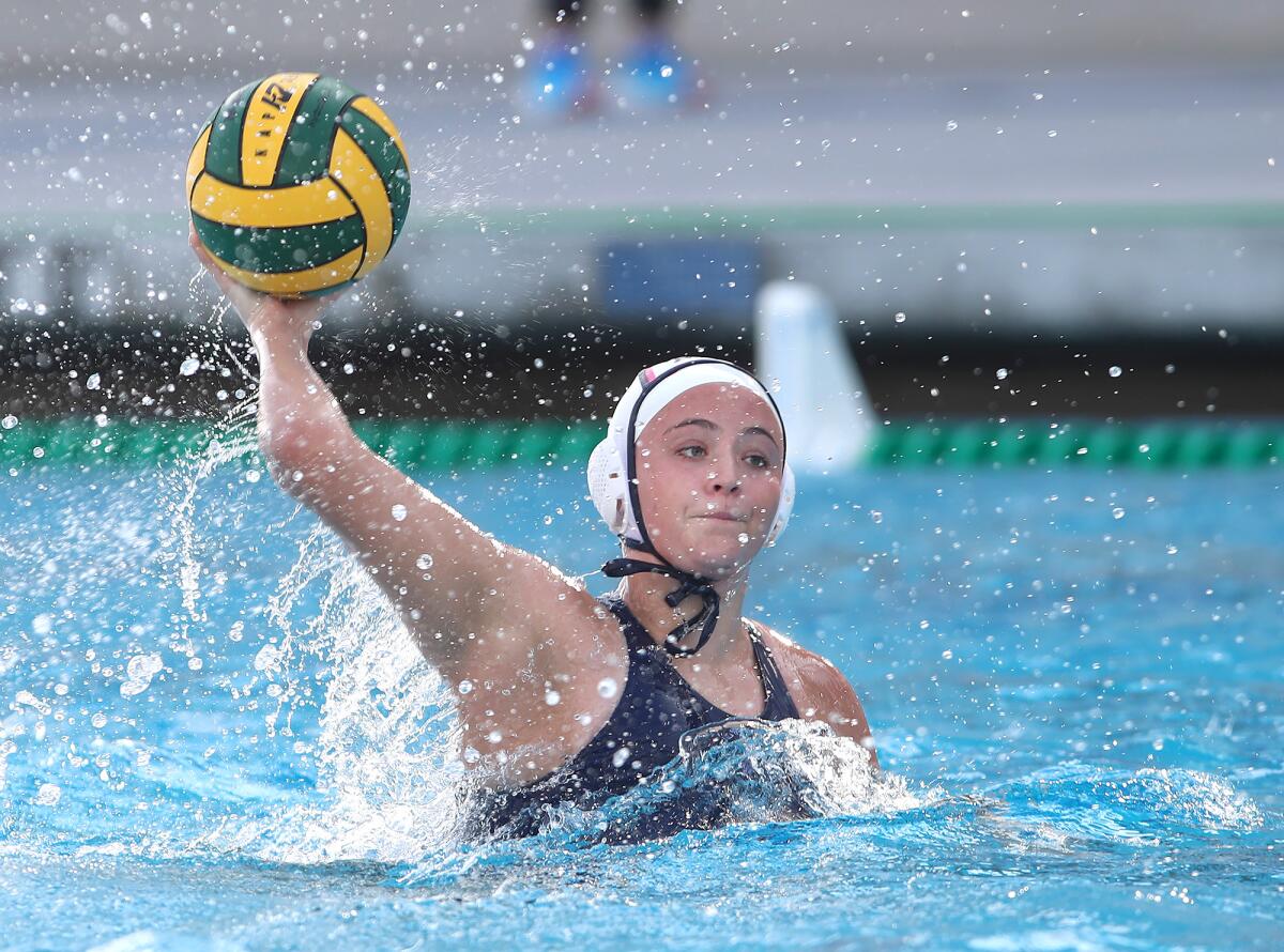 Corona del Mar's Piper Sidebotham shoots and scores her fourth goal on Saturday.