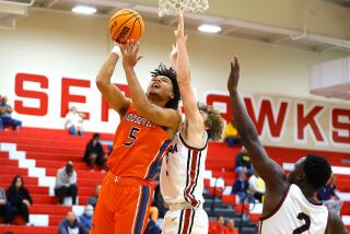 Brayden Burries of Eastvale Roosevelt goes up for shot against JSerra at Redondo Union.