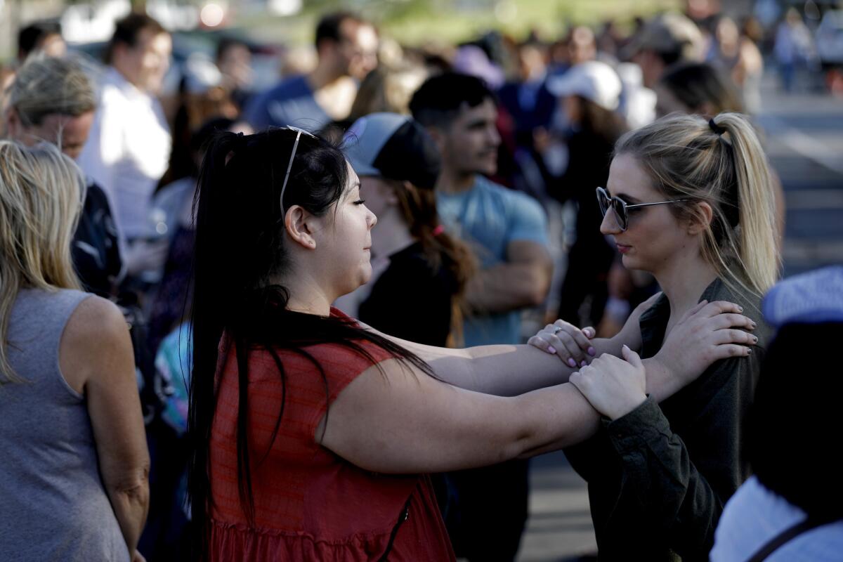 Tiffany Azpeitia, 26, left, and Jamie Eads, 23, both of Thousand Oaks, line up to donate blood for victims of the mass shooting at Borderline Bar and Grill. "It is hard, everyone is like family there," Eads said.