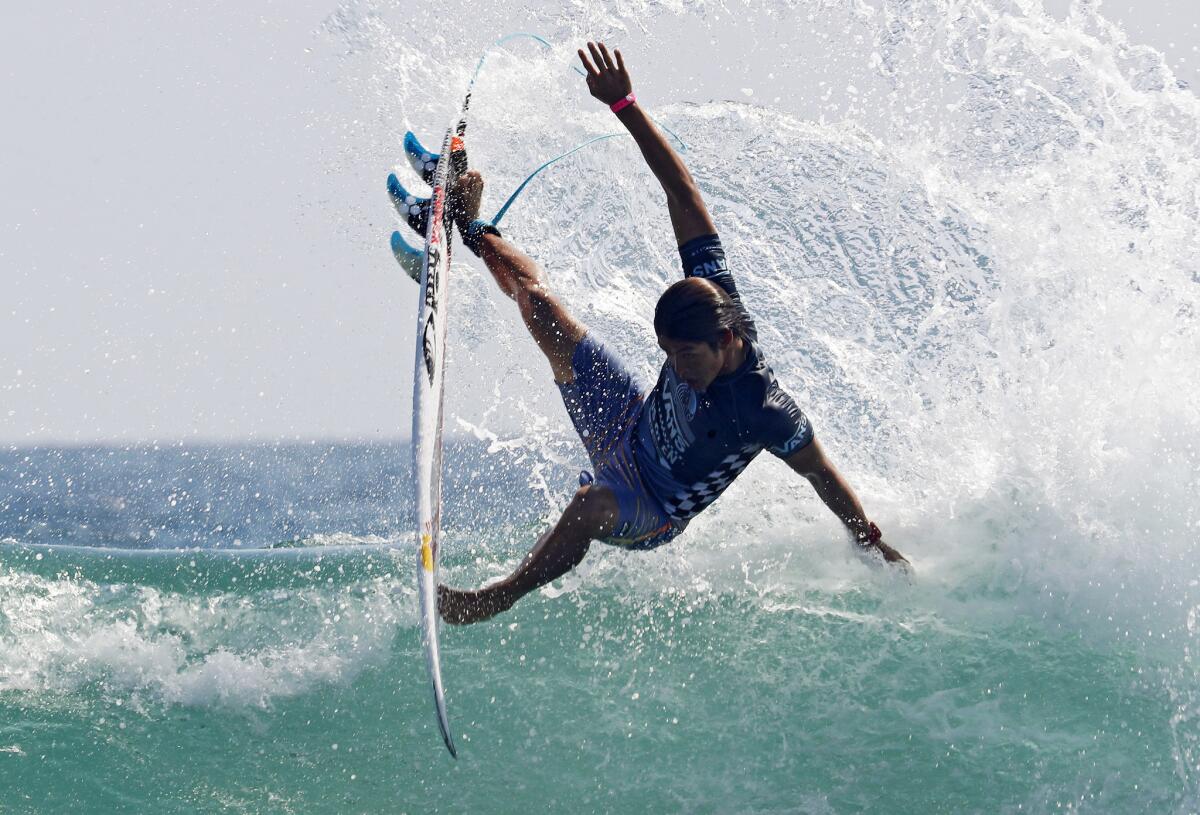 Kanoa Igarashi rides his final wave to victory over Griffin Colapinto in the finals of the 2018 Vans U.S, Open of Surfing in Huntington Beach.