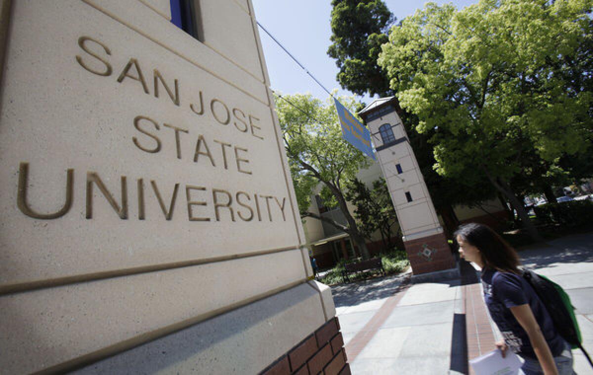 A student walks across the campus of San Jose State.