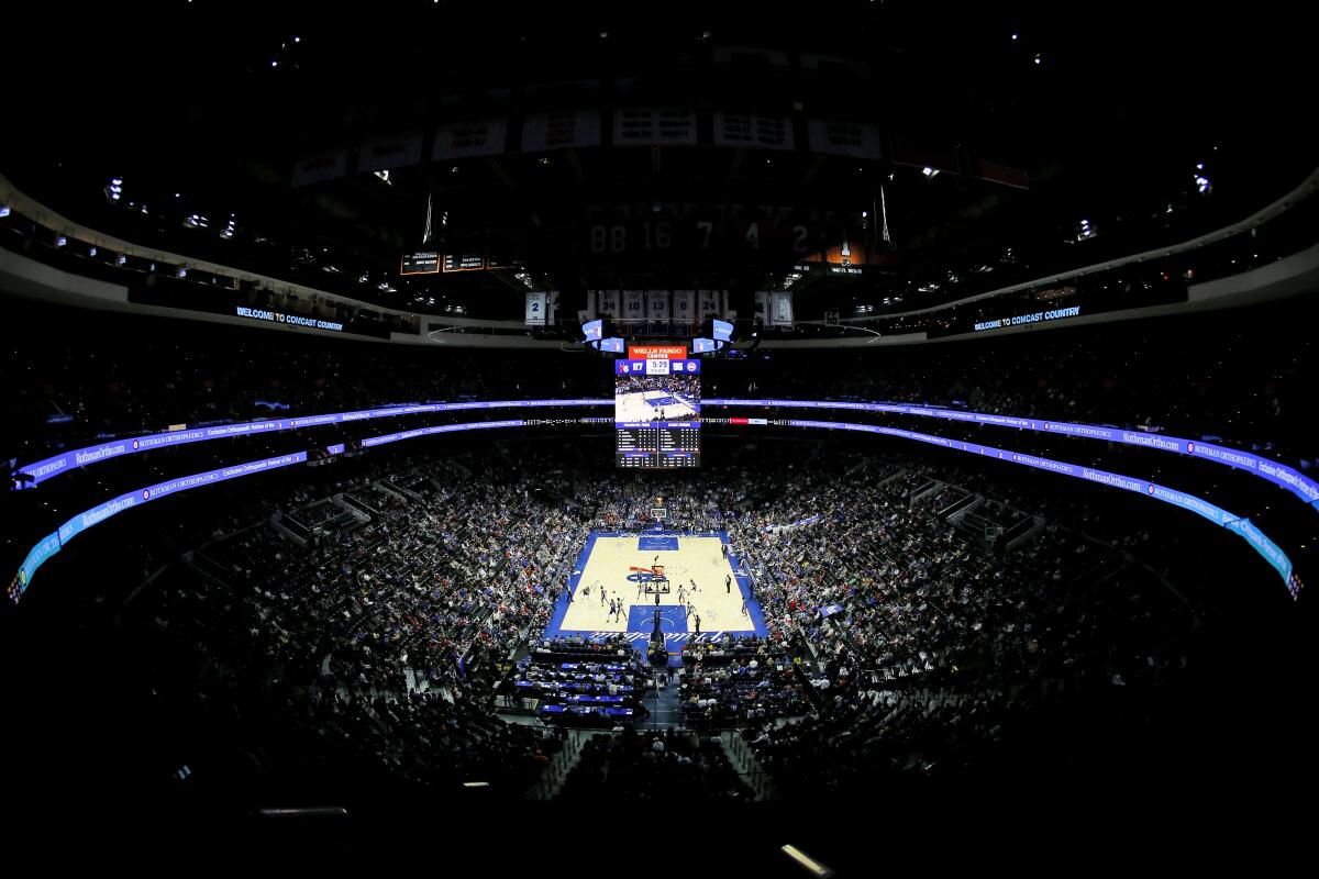 Fans watch a game between the Philadelphia 76ers and Detroit Pistons on March 11, 2020, in Philadelphia. 