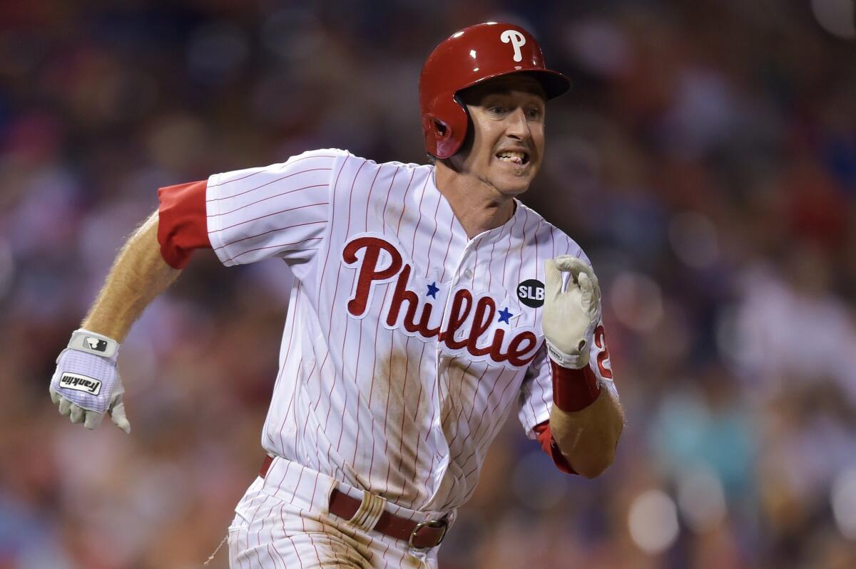 Philadelphia's Chase Utley runs to first base on a single against Toronto on Aug. 18.