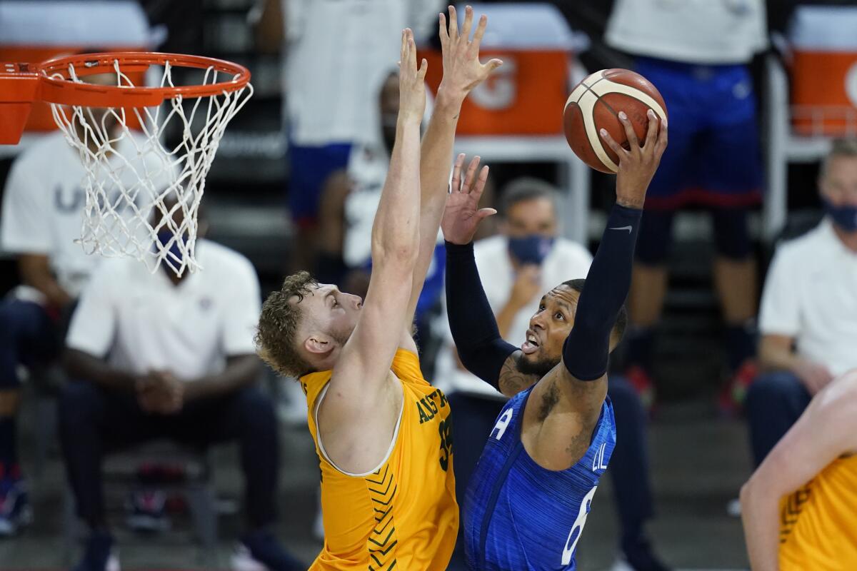 United States' Damian Lillard shoots around Australia's Jock Landale.