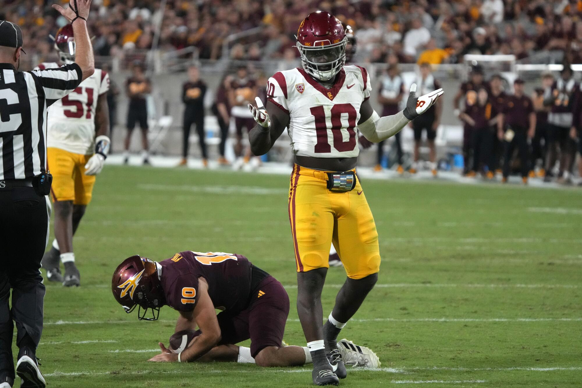 Jamil Muhammad (10) reacts after sacking Arizona State quarterback Drew Pyne in the Trojans' win on Sept. 23.