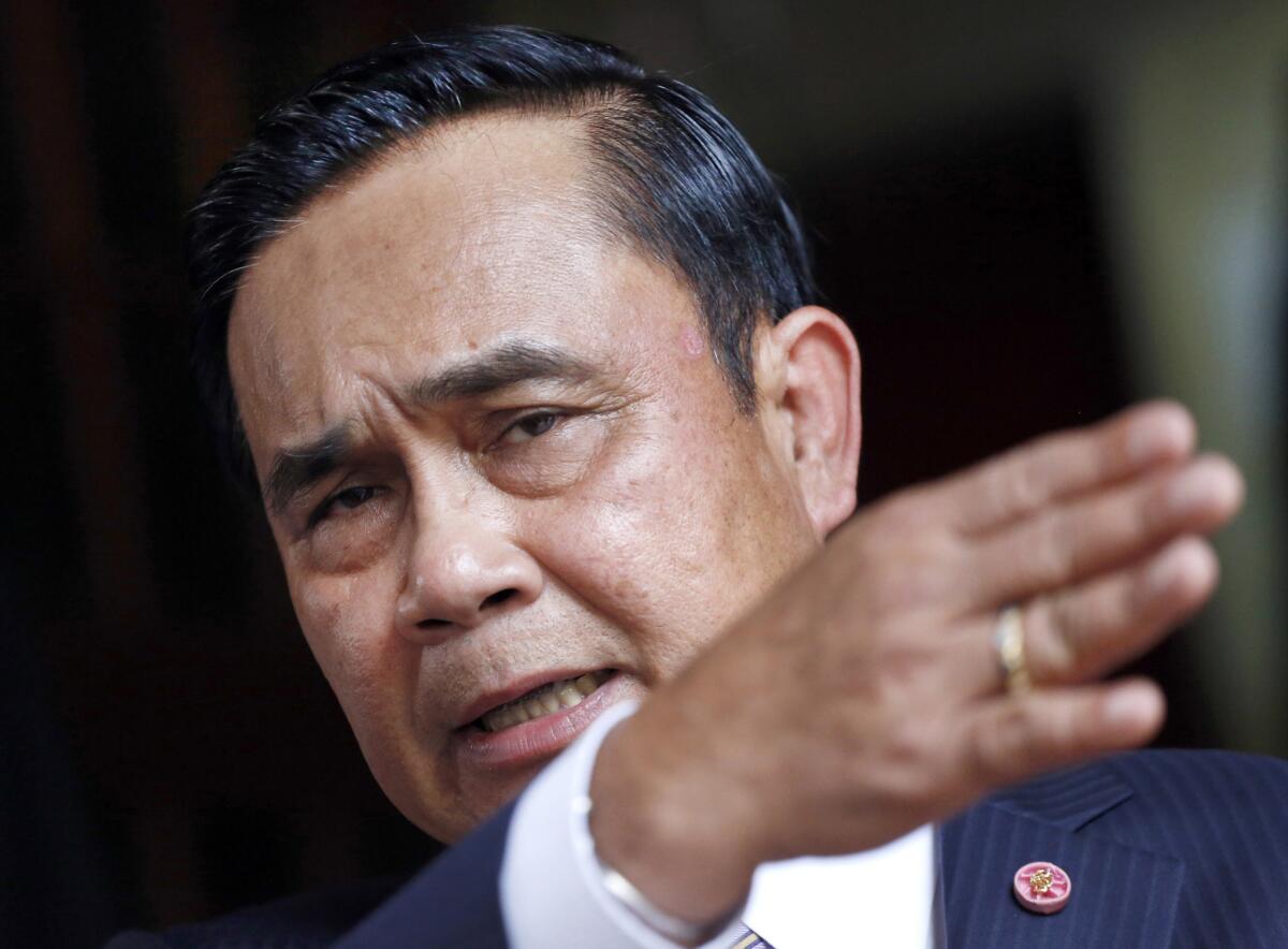 Thai Prime Minister Prayuth Chan-ocha talks to reporters at the government house in Bangkok, Thailand, on May 15, 2015.