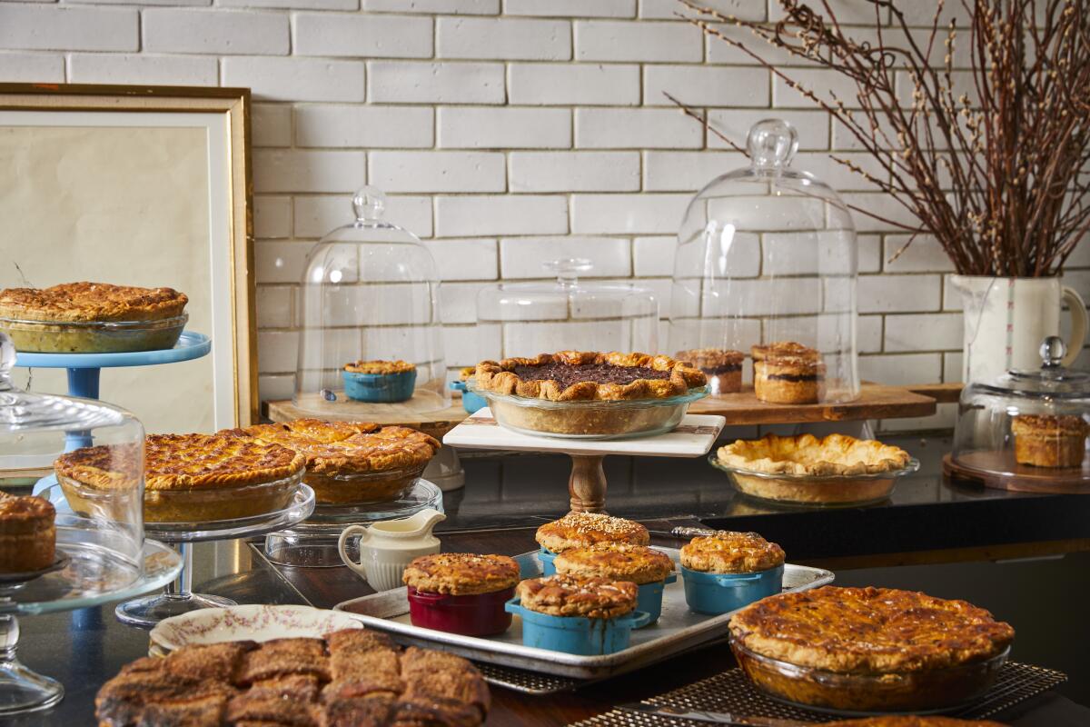 A variety of pies displayed on a serving table