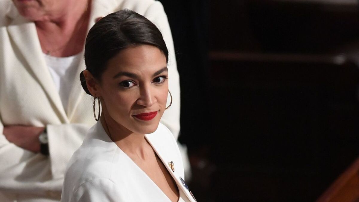 Rep. Alexandria Ocasio-Cortez (D-N.Y.), pictured at the State of the Union address Tuesday, and Sen. Edward J. Markey (D-Mass.) drafted a joint resolution to combat climate change.