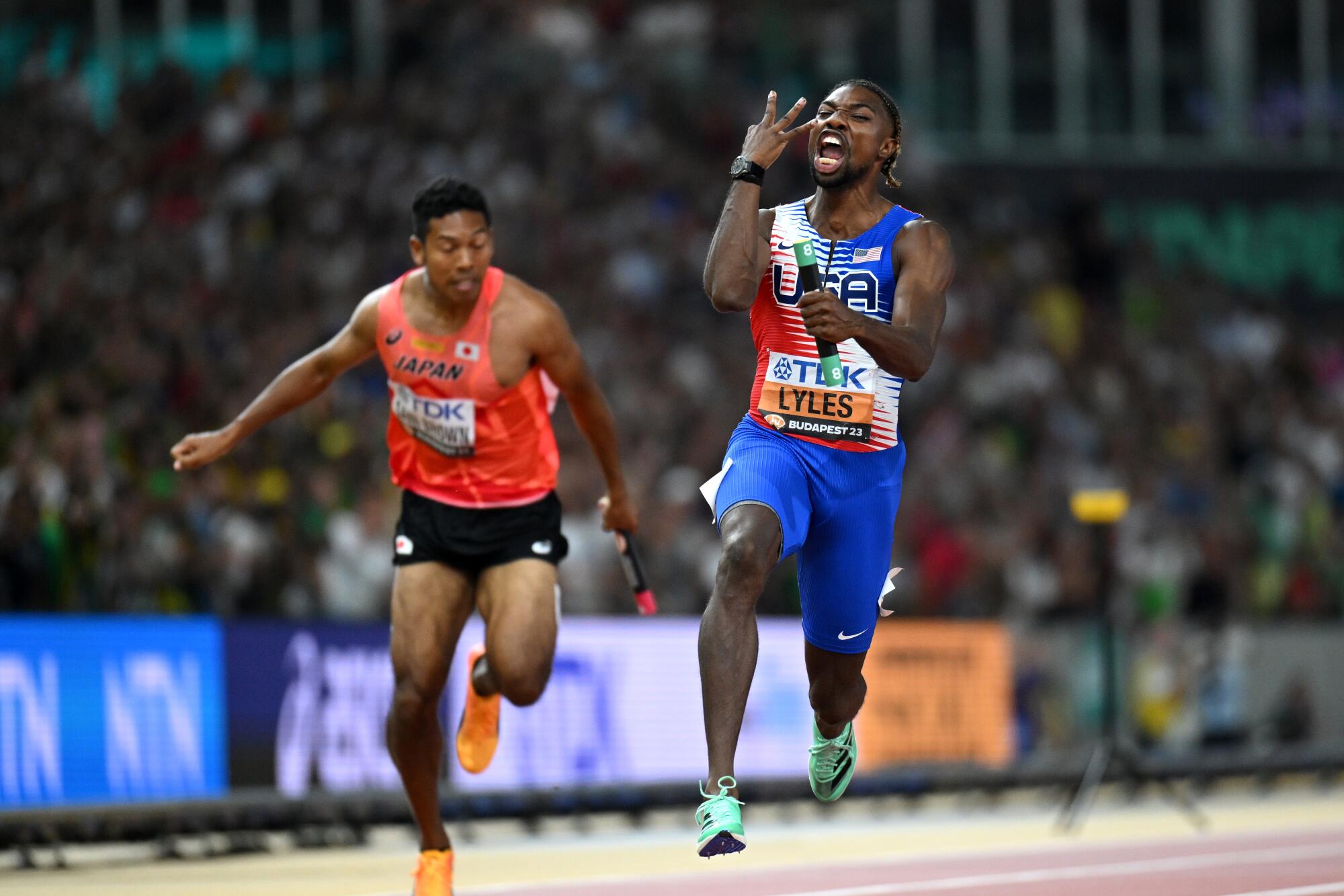 Noah Lyles celebrates after anchoring the men's 4X100-meter relay team in its victory at the World Athletics Championships.