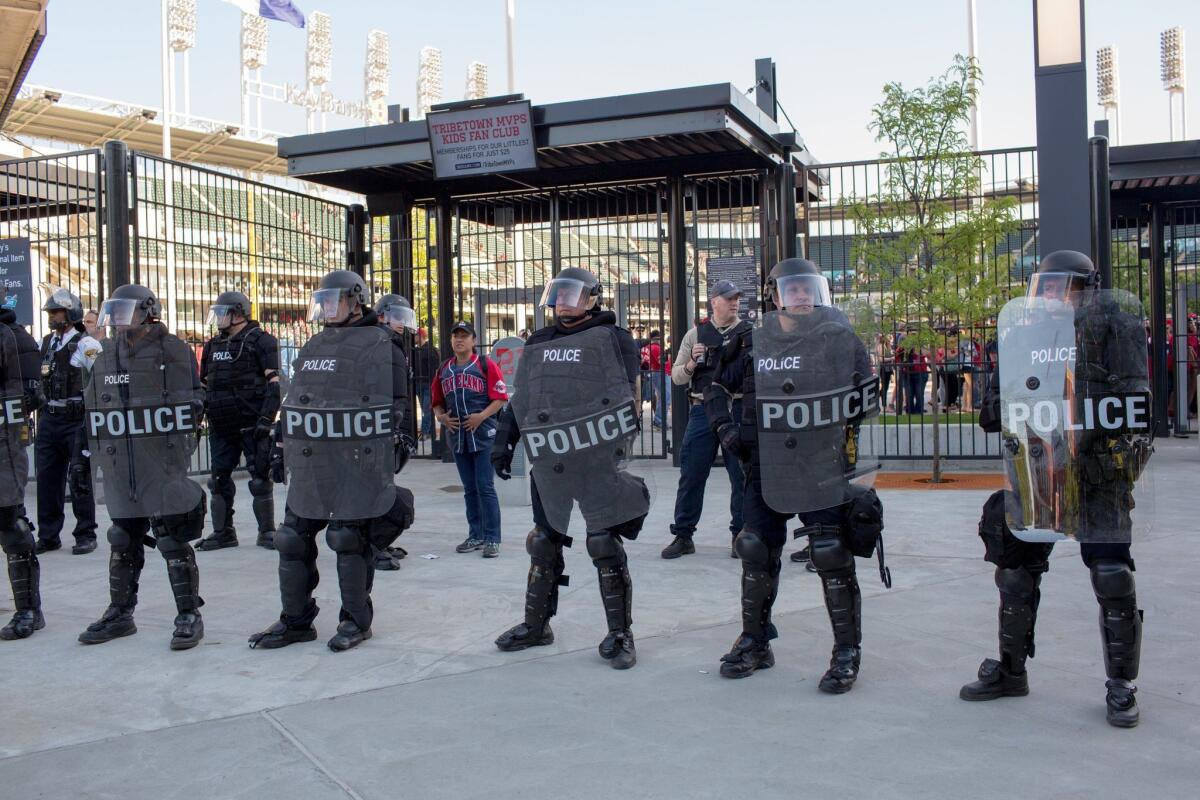 Police in front of Progressive Field stand guard during demonstrations in reaction to Cleveland police officer Michael Brelo being acquitted of manslaughter charges after he shot two people at the end of a 2012 car chase in which officers fired 137 shots.