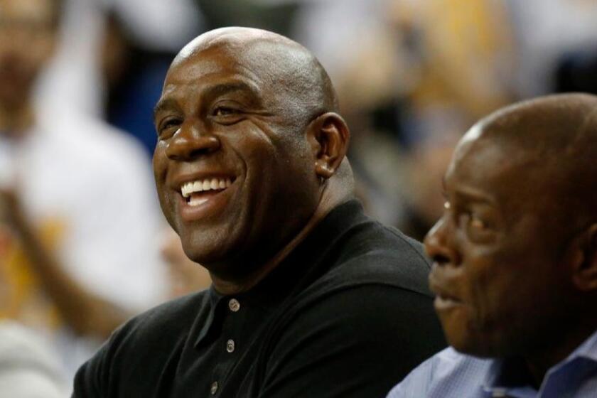 Lakers legend Magic Johnson attends a game between UCLA and Oregon at Pauley Pavilion on Feb. 9.