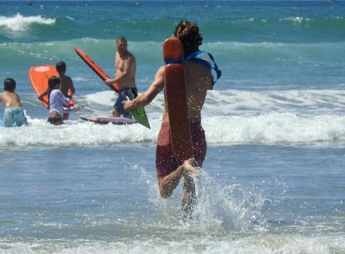 Swimmers are encouraged to enter water in front of lifeguard stations.