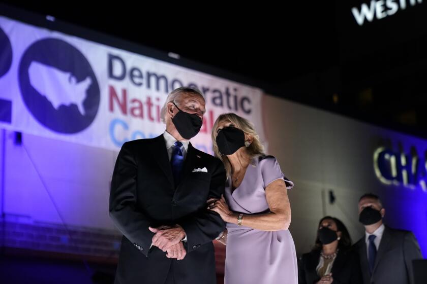 Democratic presidential candidate former Vice President Joe Biden, and his wife Jill Biden, watch fireworks with Democratic vice presidential candidate Sen. Kamala Harris, D-Calif., and her husband Doug Emhoff, during the fourth day of the Democratic National Convention, Thursday, Aug. 20, 2020, at the Chase Center in Wilmington, Del. (AP Photo/Andrew Harnik)